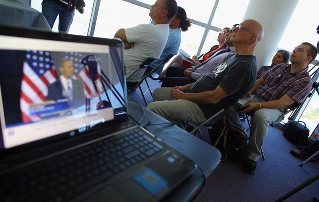 Des personnes assistent à un débat de Barack Obama, le 29 janvier 2013 à Miami [Joe Raedle / Getty Images/AFP/Archives]