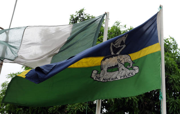 Les drapeaux nigérians et de la police nigériane [Pius Utomi Ekpei / AFP/Archives]