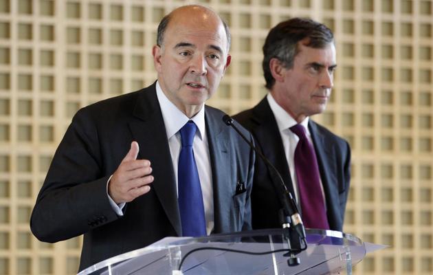 Pierre Moscovici et Jérome Cahuzac le 4 octobre 2012 à Paris [Kenzo Tribouillard / AFP/Archives]