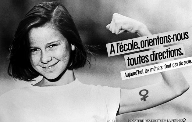 Photo prise le 6 avril 1984 de l'affiche présentant les slogans "Aujourd'hui, les métiers n'ont pas de sexe" et "L'école, orientons-nous toutes directions", de la campagne lancée par le ministère des Droits de la Femme [Julien Cassagne / AFP/Archives]