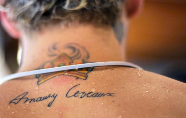 Un tatouage dans le dos du nageur français Amaury Leveaux, lors d'un entraînement le 30 septembre 2008 à Mulhouse [Sebastien Bozon / AFP/Archives]