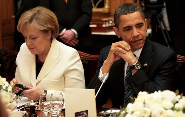 Angela Merkel et Barack Obama, le 1er avril 2009 lors d'un dîner à Londres [Christopher Furlong / Pool/AFP/Archives]