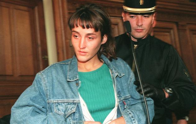 Florence Rey à l'ouverture de son procès en assises le 4 octobre 1994 à Paris [Michel Gangné / AFP]