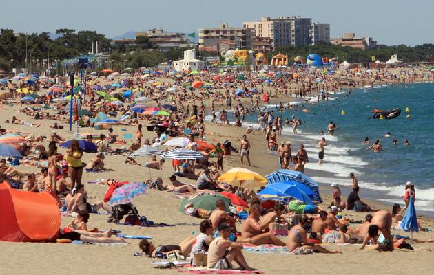 Des vacanciers à la plage le 30 juin 2013 à Argeles-sur-Mer [Raymond Roig / AFP/Archives]