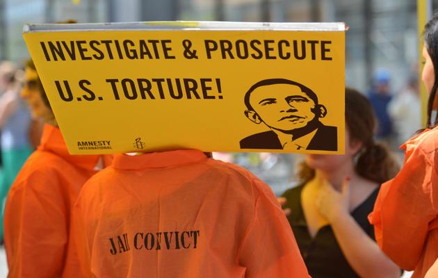Des militants d'Amnesty International manifestent pour la fermeture de la prison de Guantanamo, à Berlin le 19 juin 2013 [Oliver Lang / AFP/Archives]