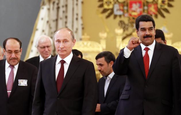 Les présidents russes et vénézuéliens, Vladimir Poutine (g) et Nicolas Maduro (d), participent au Forum des pays exportateurs de gaz, le 1er juillet 2013 à Moscou [Yuri Kochetkov / POOL/AFP]
