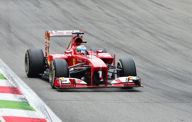 Le pilote espagnol Fernado Alonso (Ferrari) à la poursuite de Sebastian Vettel au Grand Prix d'Italie le 8 septembre 2013 à Monza [GIUSEPPE CACACE / AFP Photo]
