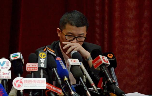 Ignatius Ong, membre de la cellule de crise de Malaysia Airlines, s'apprête à répondre aux questions des journalistes lors d'une conférence de presse à Pékin le 9 mars 2014 [Wang Zhao / AFP]
