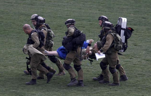 Evacuation d'un soldat israélien blessé lors d'une explosion le 18 mars 2014 sur le Golan  [Jalaa Marey / AFP]