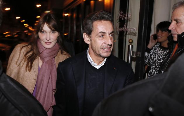 L'ex-chef de l'Etat Nicolas Sarkozy et son épouse Carla Bruni, le 28 janvier 2013 à Paris [Kenzo Tribouillard / AFP/Archives]