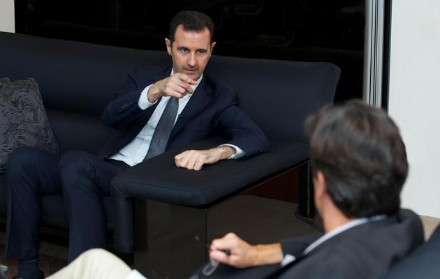 Bachar al-Assad s'entretient avec le journaliste français Georges Malbrunot, le 2 septembre 2013 à Damas [ / Présidence syrienne/AFP]