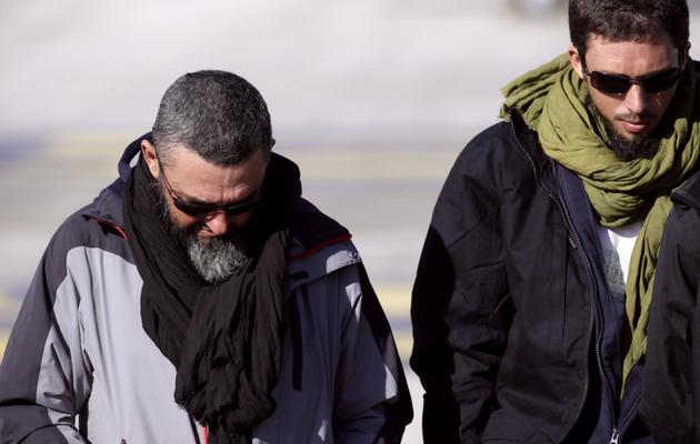 Marc Féret et Pierre Legrand à leur arrivée le 30 octobre 2013 à l'aéroport de Villacoublay [Kenzo Tribouillard / AFP]