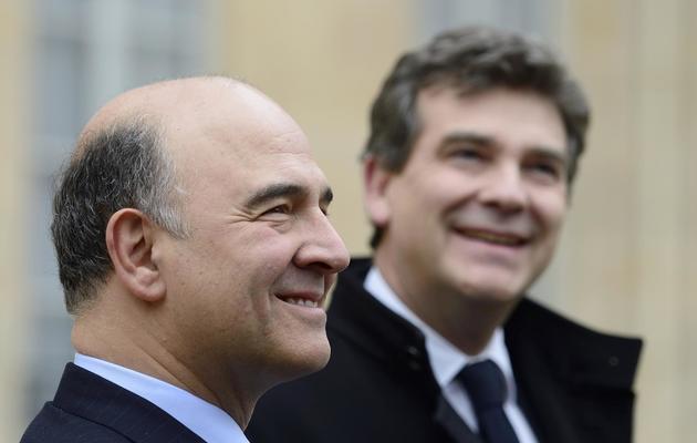 Pierre Moscovici (g) et Arnaud Montebourg, le 27 novembre 2013, quittent l'Elysée après la réunion du conseil des ministres [Eric Feferberg / AFP]
