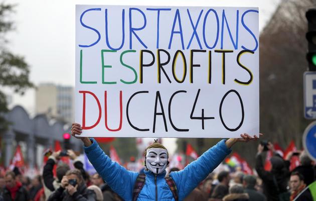 Un participant à la marche du Front de gauche à Paris, le 1er décembre 2013 [Thomas Coex / AFP]