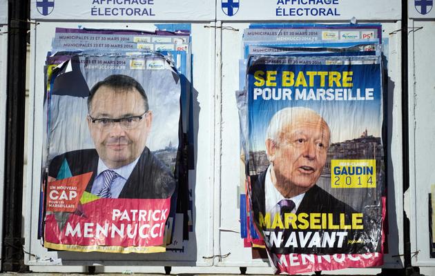 Affiches électorales des deux principaux candidats à la mairie de Marseille, Patrick Menucci (PS) et Jean-Claude Gaudin (UMP), le 7 mars 2014 [Bertrand Langlois / AFP/Archives]