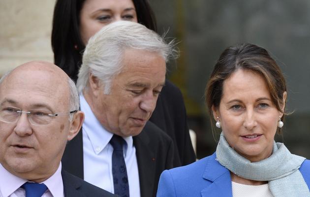 Michel Sapin, François Rebsamen et Ségolène Royal à la sortie du premier Conseil des ministres le 4 avril 2014 à l'Elysée à Paris [Lionel Bonaventure / AFP]