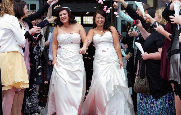 Jess Ives et Rachel Briscoe lors de leur mariage à Rotorua le 19 août 2013 [Marty Melville / AFP]