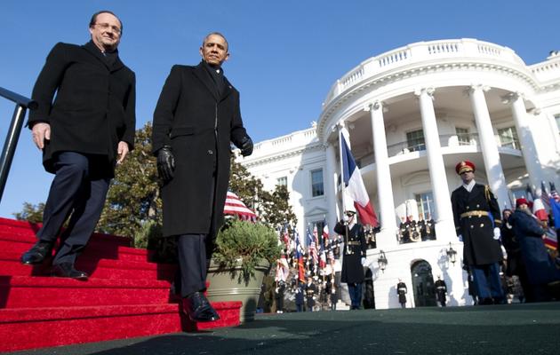 François Hollande et Barack Obama devant la Maison Blanche à Washington DC, le 11 février 2014 [Saul Loeb / AFP]