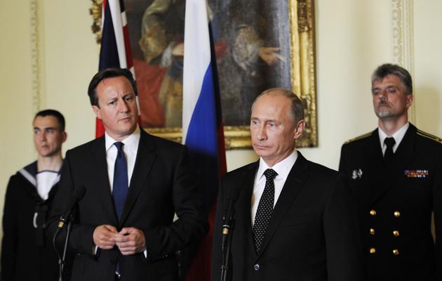 David Cameron et Vladimir Poutine le 16 juin 2013 à Londres [Facundo Arrizabalaga / Pool/AFP]