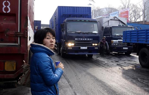 Des camions nord-coréens passent la douane chinoise à Dandong, le 14 décembre 2012 [Wang Zhao / AFP]