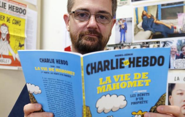 Le directeur de l'hebdomadaire Charlie Hebdo Charb présente sa BD "La vie de Mahomet", le 27 décembre 2012 à Paris [Francois Guillot / AFP]