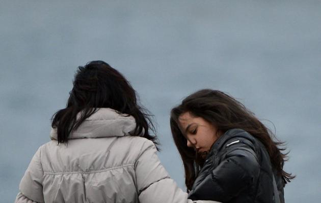 Des proches des victimes du Costa Concordia participent à la cérémonie d'anniversaire du naufrage, le 13 janvier 2013, sur l'île toscane du Giglio en Italie [Alberto Pizzoli / AFP]
