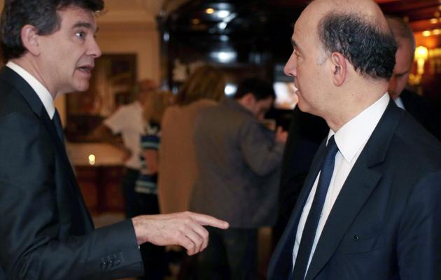 Le ministre de l'Economie Pierre Moscovici (G) et celui du Redressement productif Arnaud Montebourg, le 11 avril 2013 à Paris [Jacques Demarthon / AFP]
