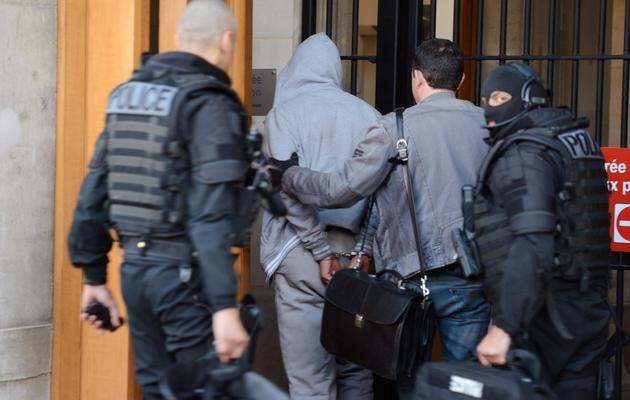 Le suspect   arrêté dans les Yvelines à son arrivée le 29 mai 2013 dans les locaux de la BRI à Paris [Eric Feferberg / AFP]