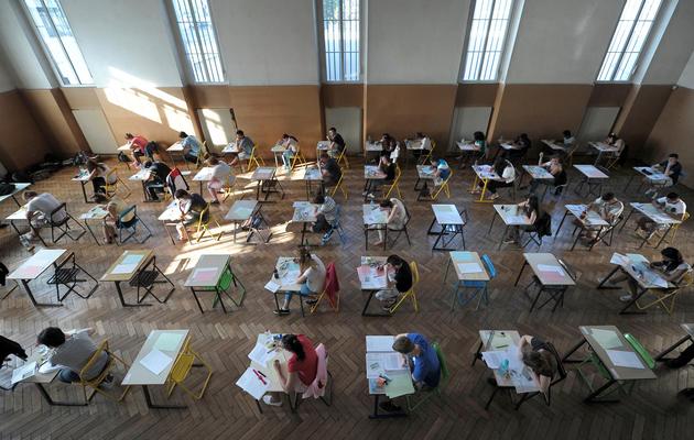 Des étudiants planchent sur leur épreuve de philosophie, le 17 juin 2013 au lycée Pasteur à Strasbourg [Frederick Florin / AFP]