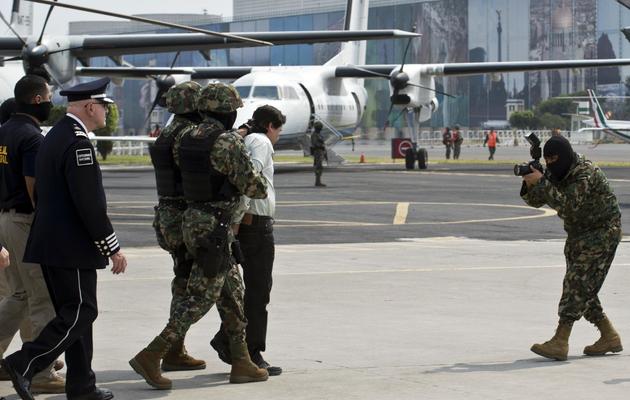Arrestation du trafiquant de drogue mexicain Joaquin "Chapo" Guzman, le 22 février 2014 à Mexico [Ronaldo Schemidt / AFP]